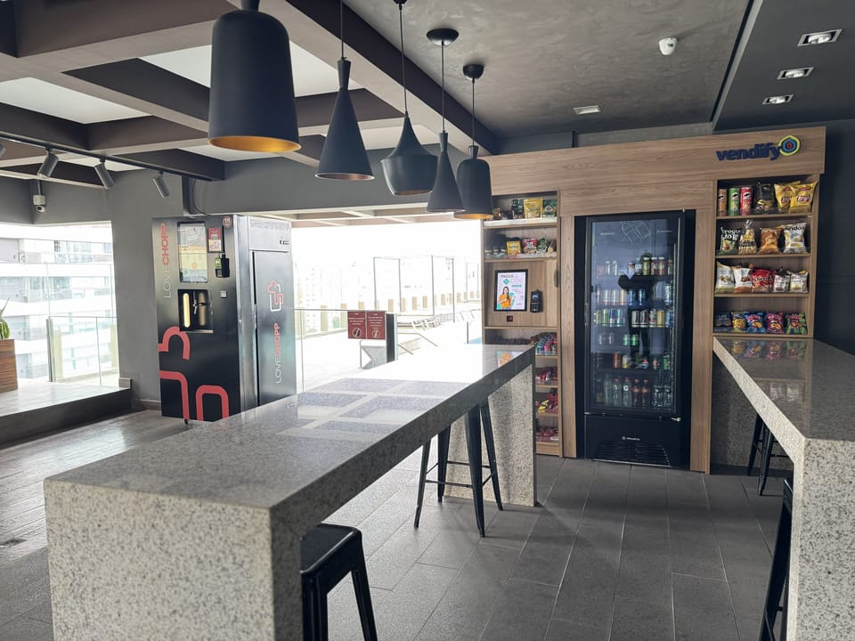 Pool hub with draft beer dispenser, snack and beverage bar