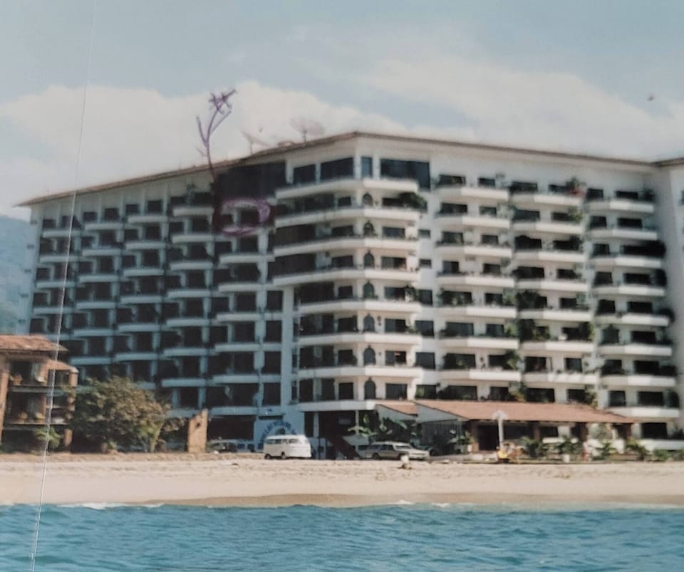 building with arrow to 8th floor
9 floors in total  Pool is rooftop