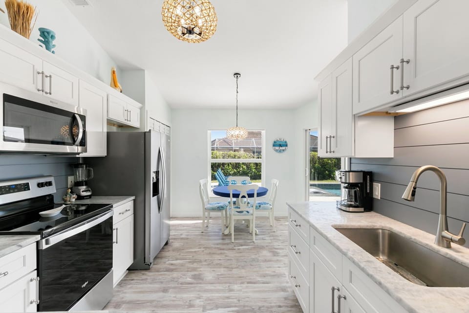 Lots of storage and counter space plus granite tops and stainless appliances.