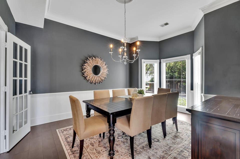 Spacious Dining Rm w/ table that can seat 8+. French doors to hall & kitchen