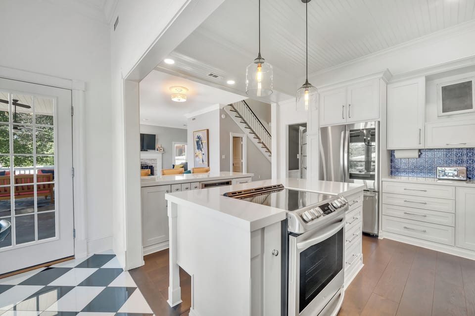 Upgraded appliances in gourmet kitchen, open to family room