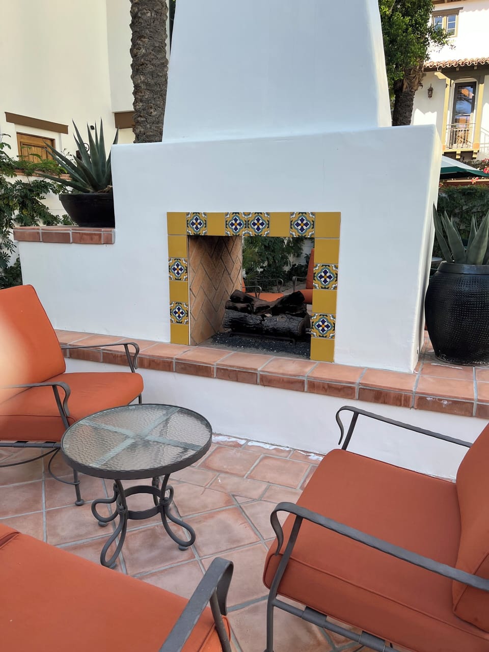 outdoor fireplace by master pool