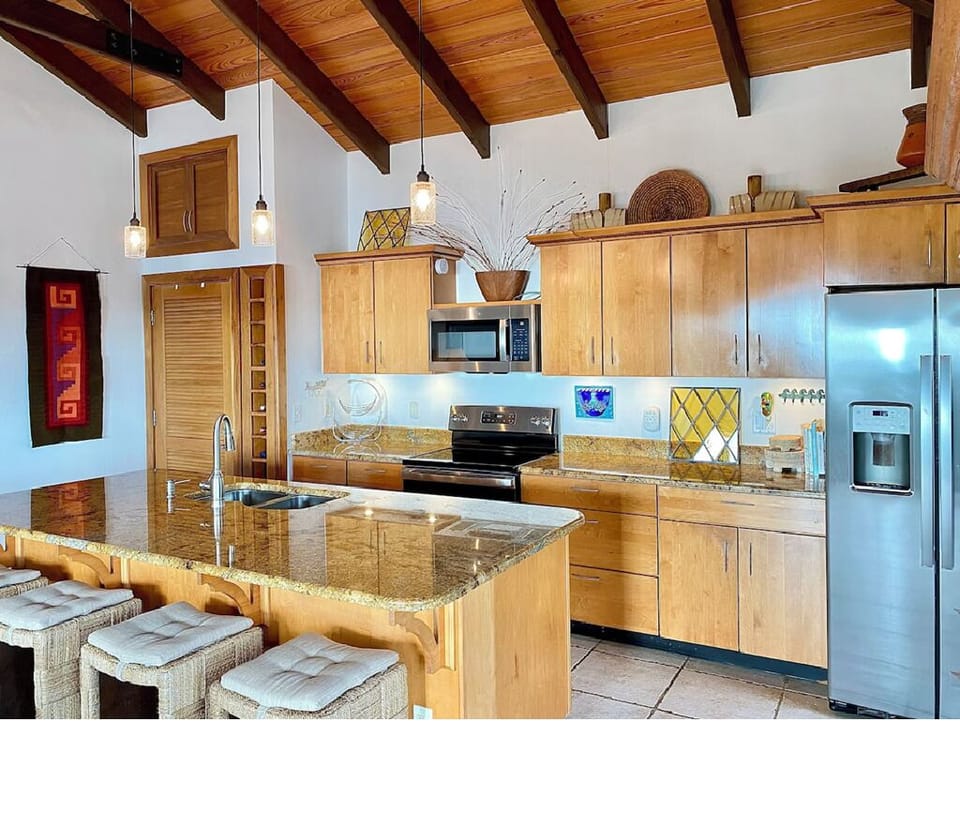Well stocked kitchen with stainless appliances
