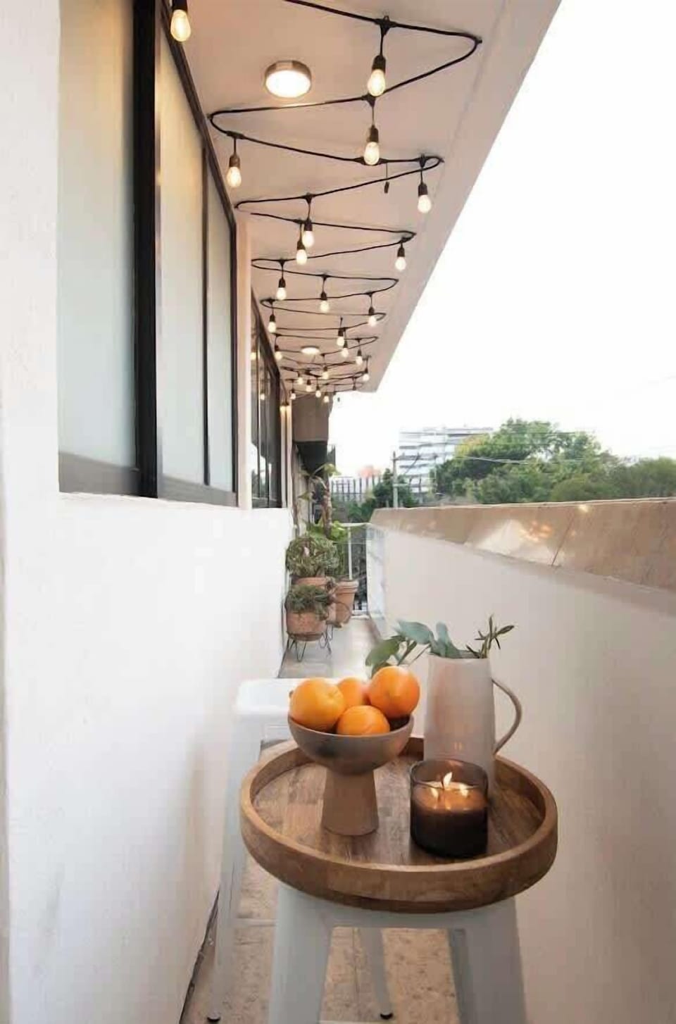 Cozy balcony space with city views, ideal for morning coffee or unwinding in the evening.