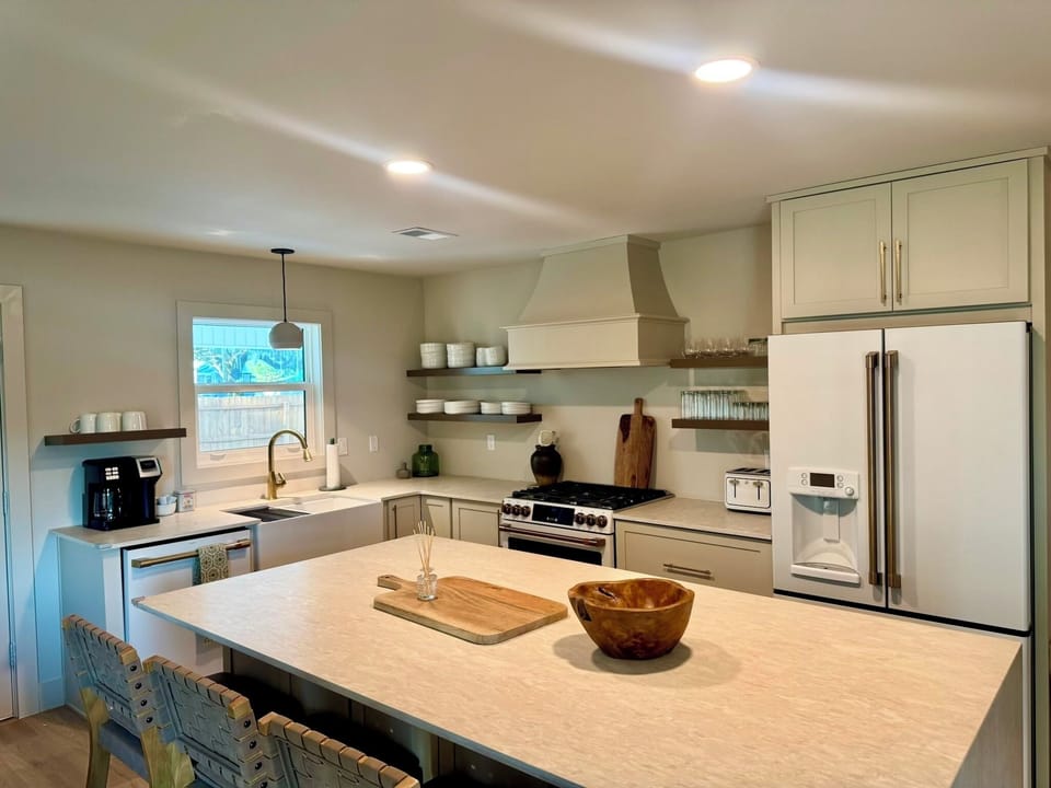 Stocked chef's kitchen with new Cafe appliances and all new supplies.