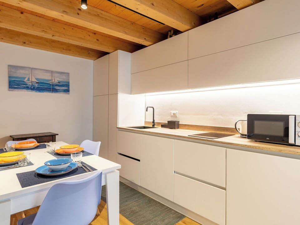 Kitchen, Flooring, Interior Design, Countertop, Wood, Floor, Kitchen Appliance, Major Appliance, Furniture, Ceiling