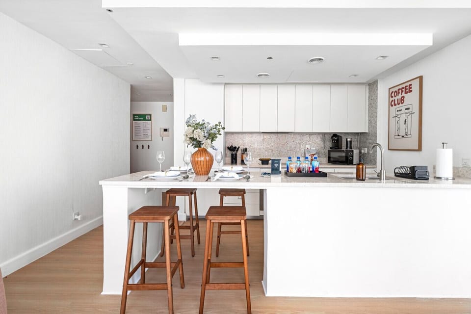 Modern kitchen, Dining area with open living space and balcony access.