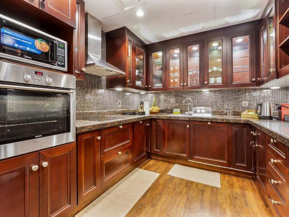 Equipped with a built-in stove, oven, microwave, and essential supplies such as dishwashing liquid for your convenience.