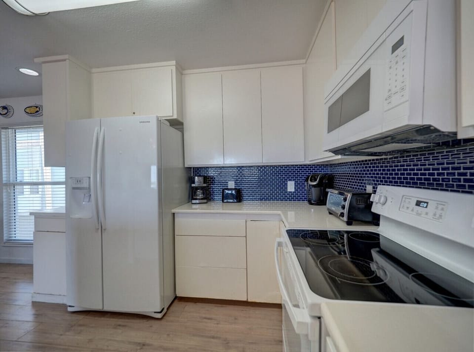 Modern appliances and a splash of coastal color