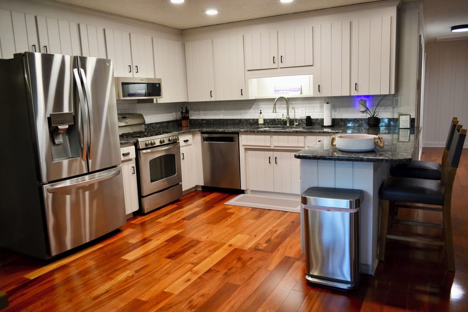 Fully stocked kitchen with gas range.
