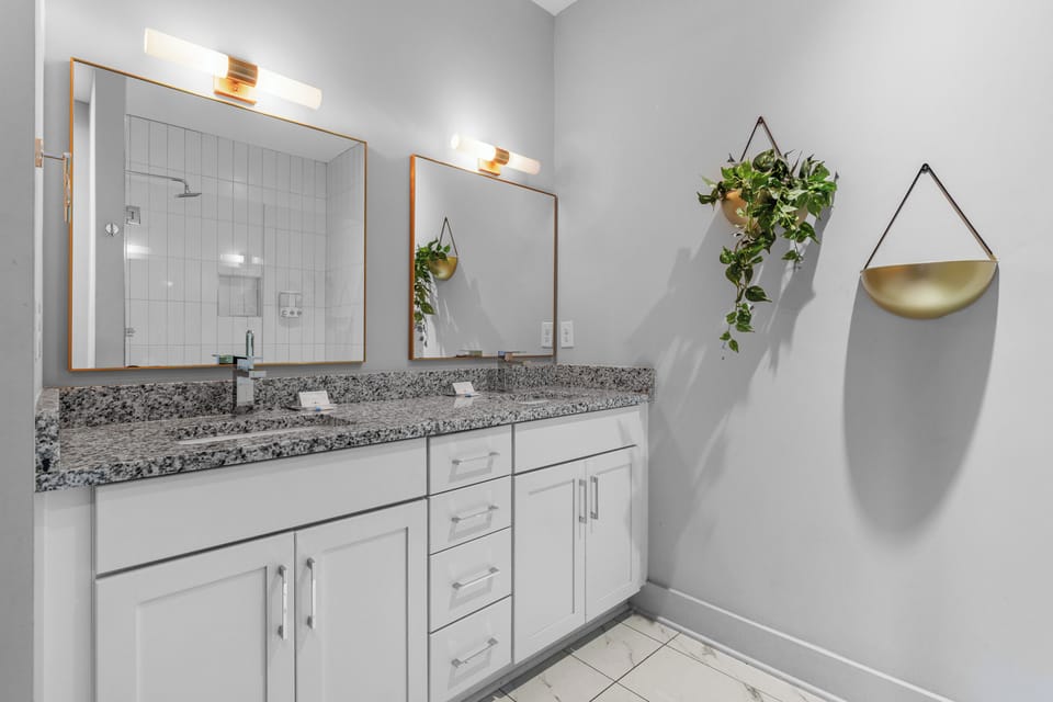 Large double vanity offers plenty of storage and room for getting ready.