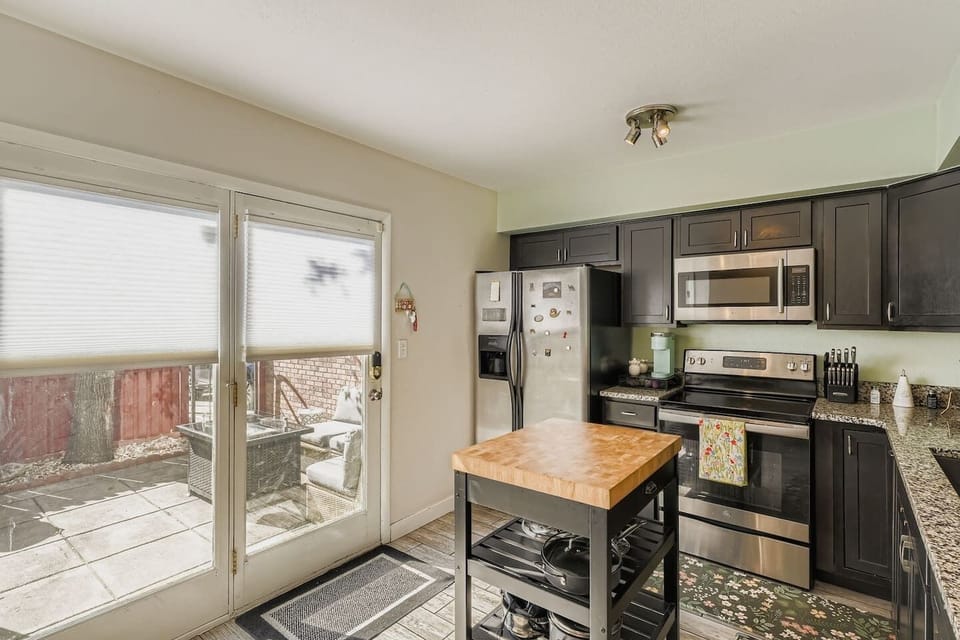 Fully equipped kitchen with walkout patio
