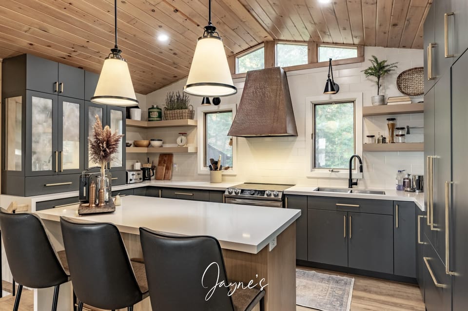 Modern kitchen with spacious island and cozy wood accents