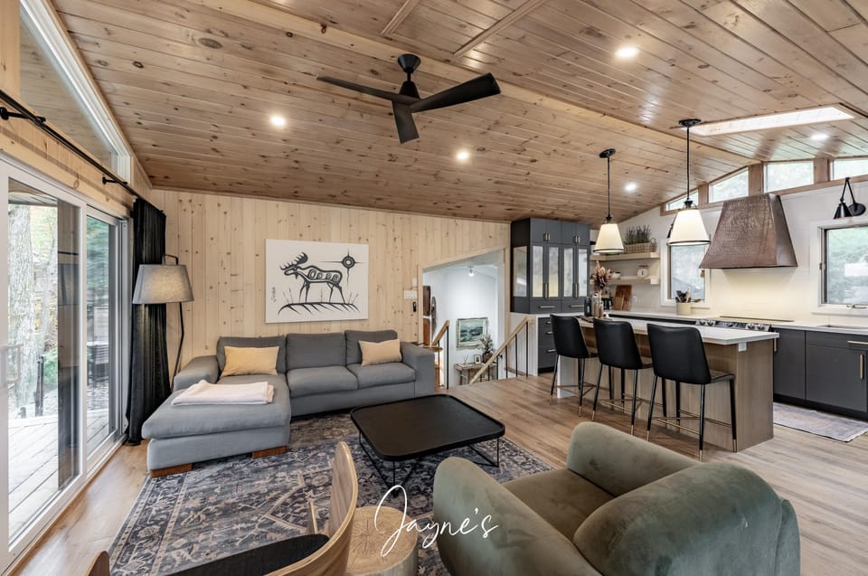 Spacious open-concept living and kitchen with rustic charm