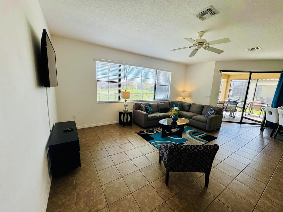 Spacious living room with panoramic window views and cozy seating