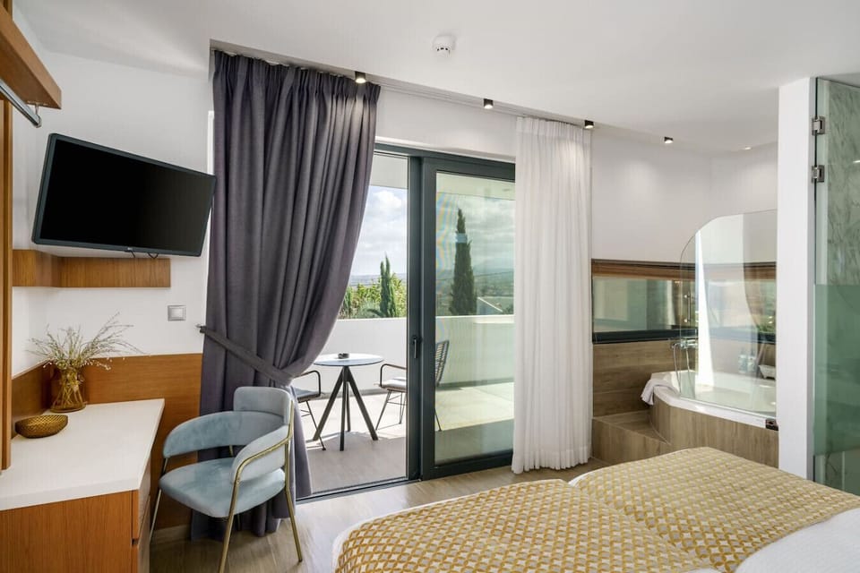 Twin bedroom with ensuite bathroom and direct access to a private balcony.