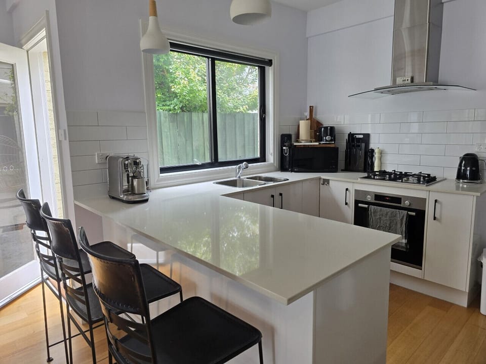Share meals, coffee or conversation around the kitchen island.
