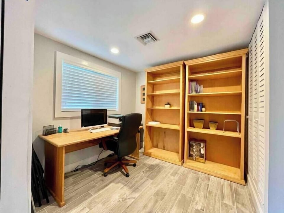Office space with a computer and printer.