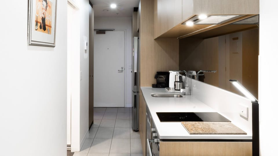 Fully equipped kitchen with sleek appliances and modern finishes.