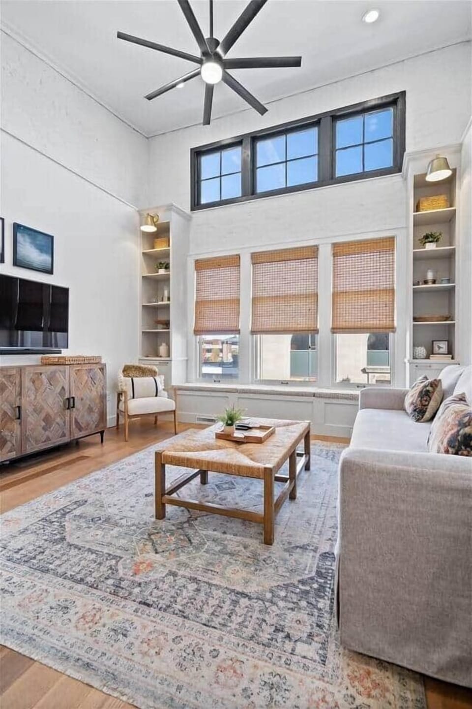 Soaring 14-foot ceilings + natural light create an open, airy retreat in downtown Muncie.