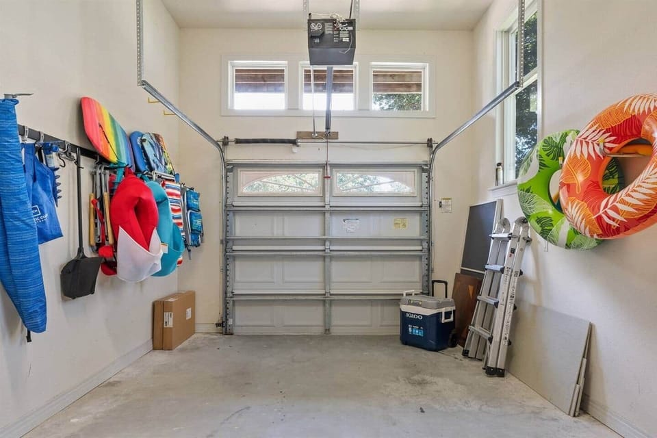 Garage space holds beach chairs, beach umbrella, boogie boards, and pool floats.