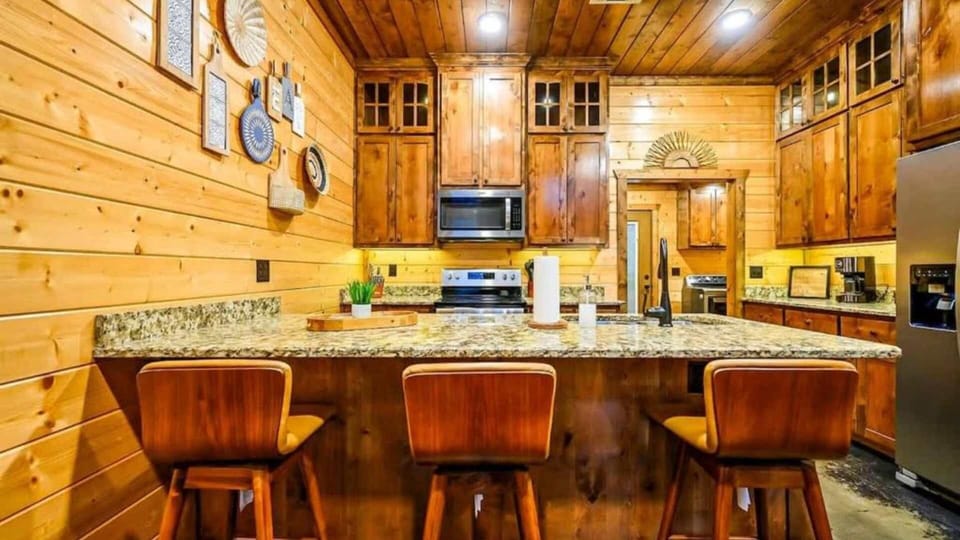 Beautiful wood cabinetry and granite island—perfect for family gatherings.