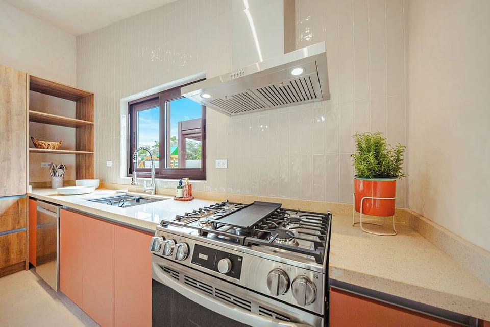 From the stainless steel gas range and griddle to the modern hood, this kitchen is ready for your culinary creations. Enjoy the convenience of a chef-ready space during your entire stay.