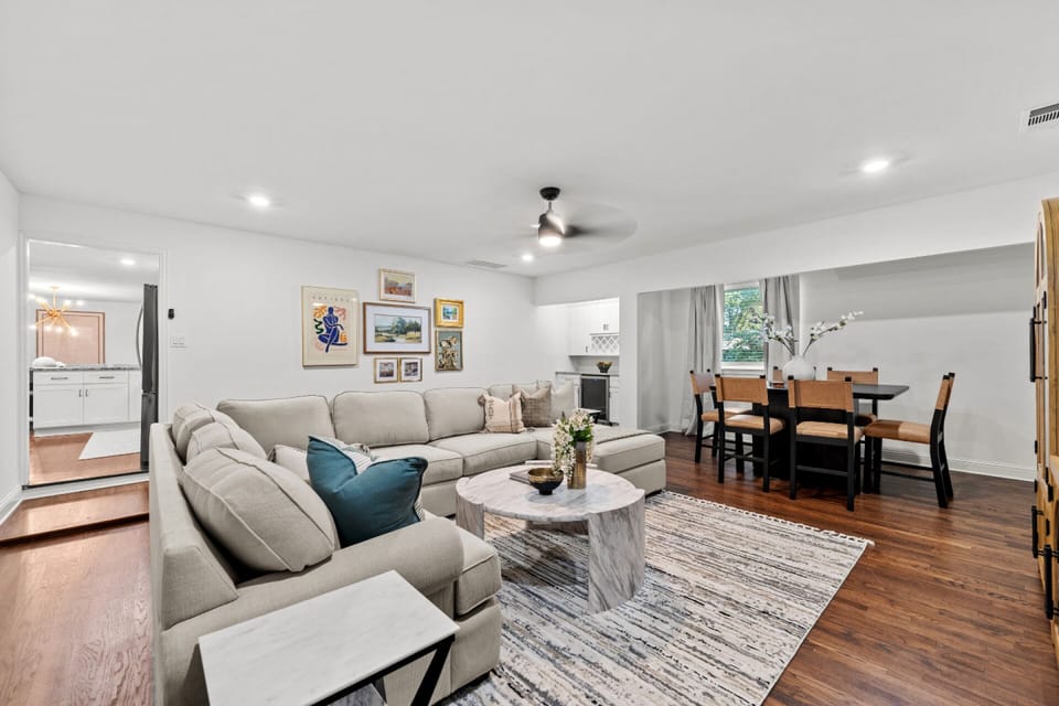 Open living and dining spaces designed for group stays, with comfortable seating and easy flow into the kitchen — minutes from Brookhaven College, Addison nightlife, and local Dallas coffee shops.