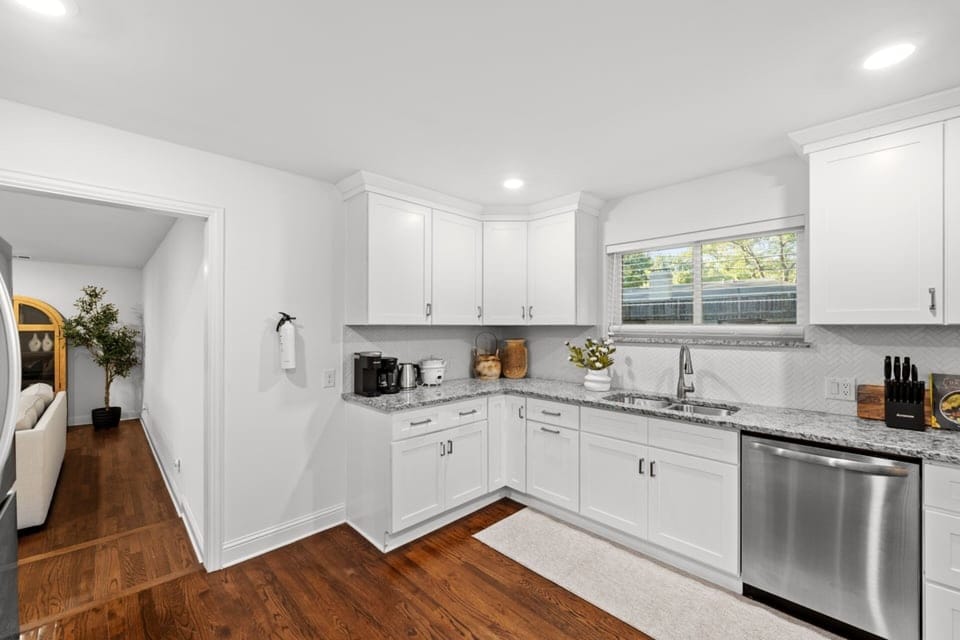Fully stocked kitchen with modern appliances, generous counter space, and natural light — ideal for meal prep during business trips, weekend getaways, or extended Dallas stays near Addison and Northwest Highway dining.