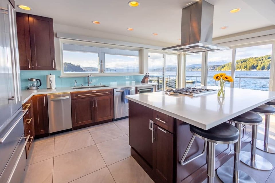 Fully outfitted kitchen with GE gas range and oven, wine cooler, full fridge with freezer, etc.