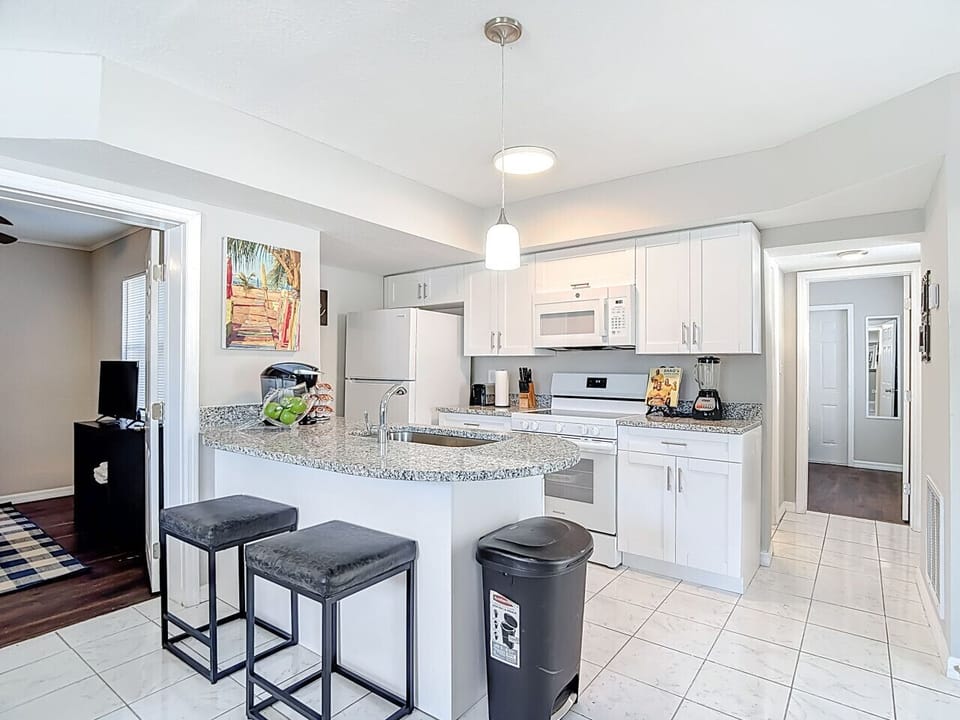Open kitchen with bar seating