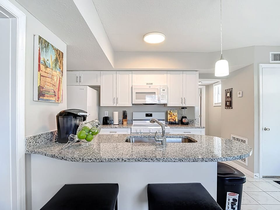 Open kitchen with bar seating