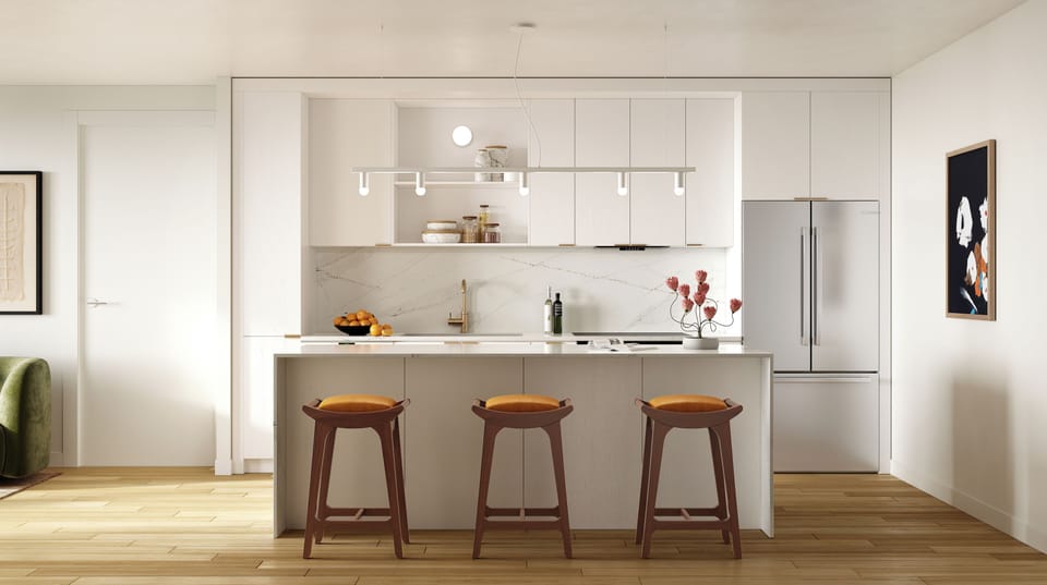 1 Bedroom Suite: Modern kitchen with sleek design and island seating.