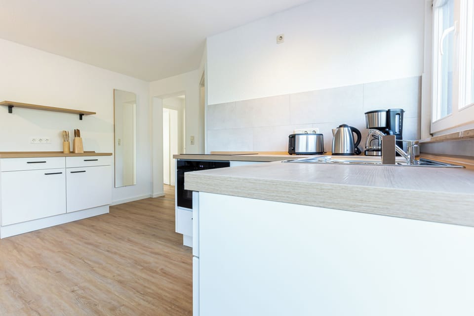 Modern Kitchen with Appliances and Wooden Surfaces