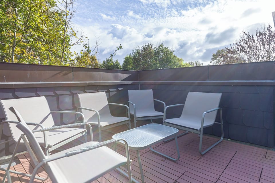 Terrace with modern chairs and table