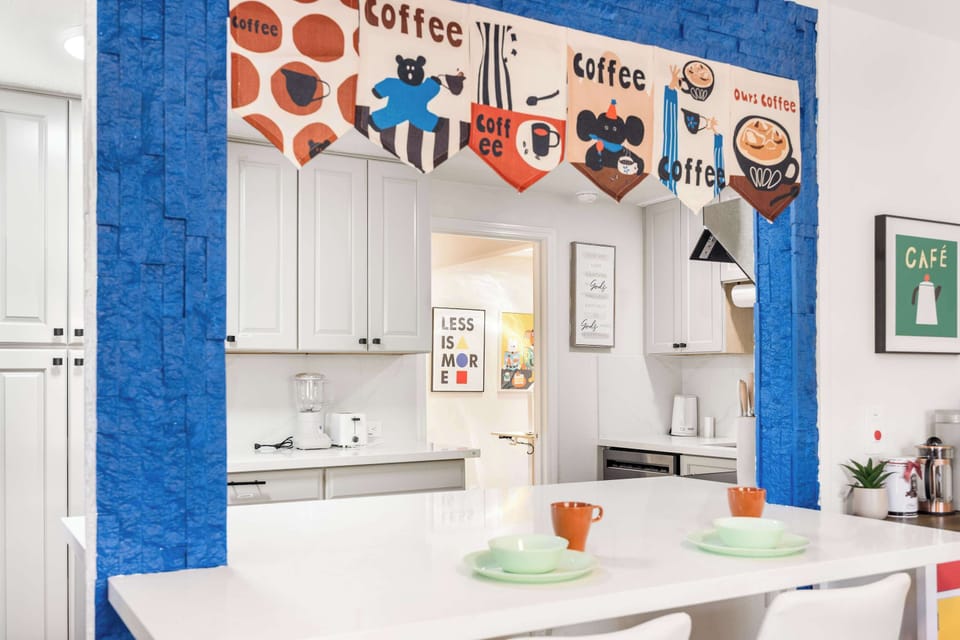 Well-equipped kitchen with a cheerful café-style vibe.