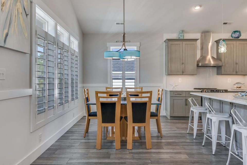 Gather around this beautiful dining space where your morning coffee and evening meals become memorable moments in a stylish, open-concept setting.