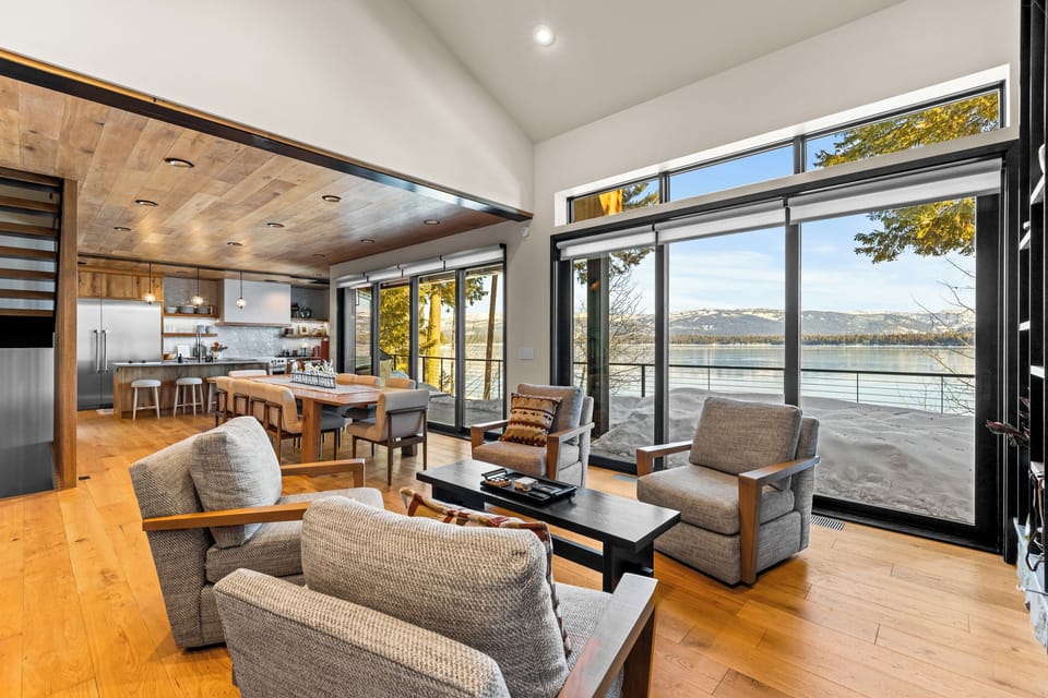 At Lakefront Luxe, enjoy the stunning lake and mountain views through floor-to-ceiling windows. Whether you're inside or outside, nature is always in sight. Ready to relax with a view?