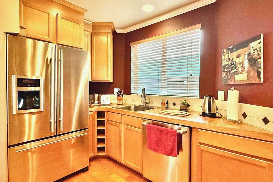 Large kitchen with view of backyard.