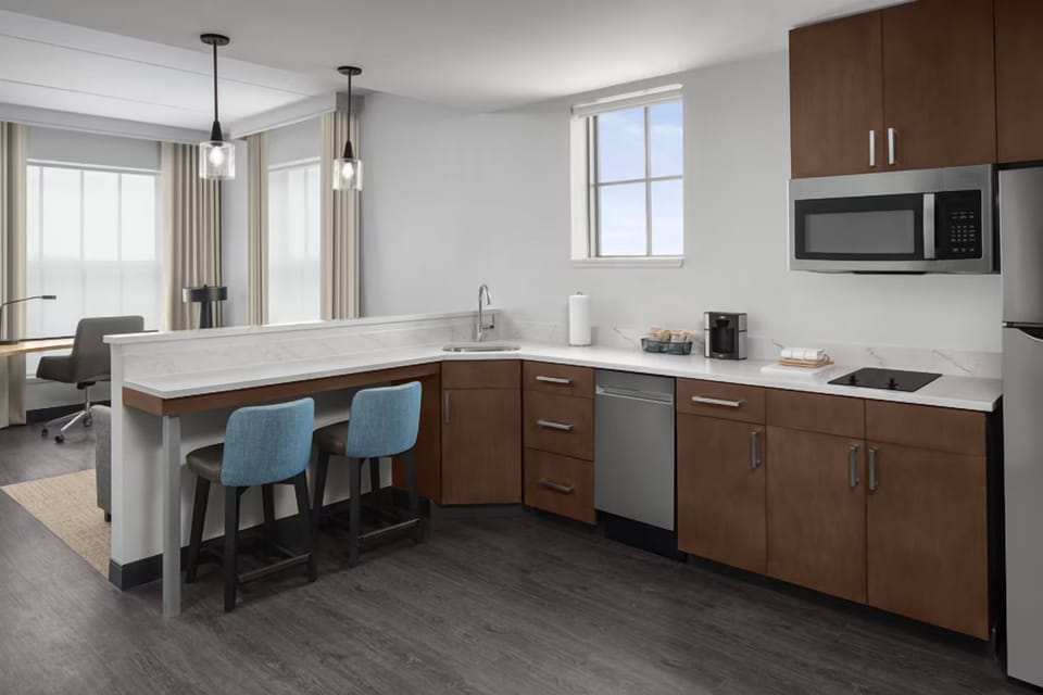 Cook and gather together in a sleek, fully equipped kitchenette.