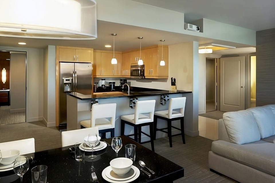Gather for dinner in an open-concept suite made for relaxing.