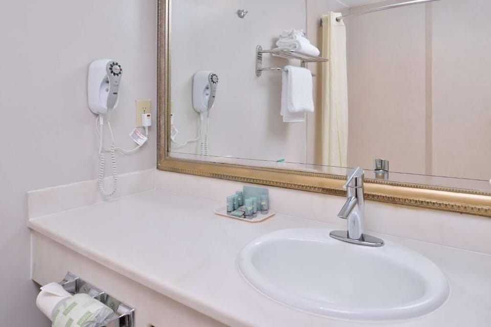 Freshen up at the bright vanity with toiletries ready.