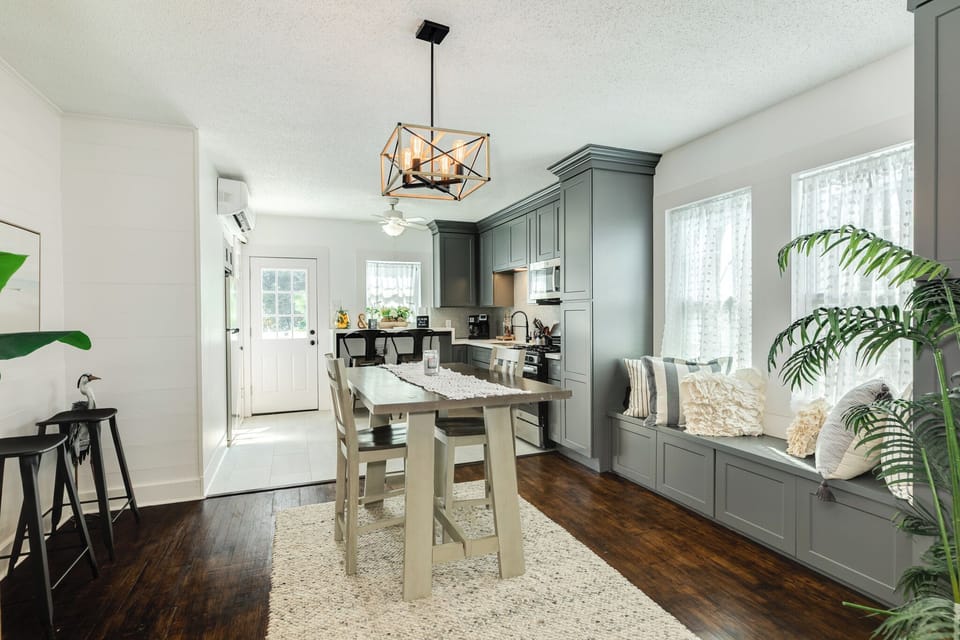 Bright cottage kitchen and dining with a cozy window bench for relaxing

