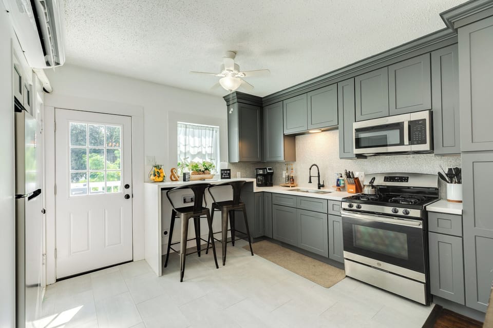 Clean, modern cottage kitchen with a cozy breakfast bar for two
