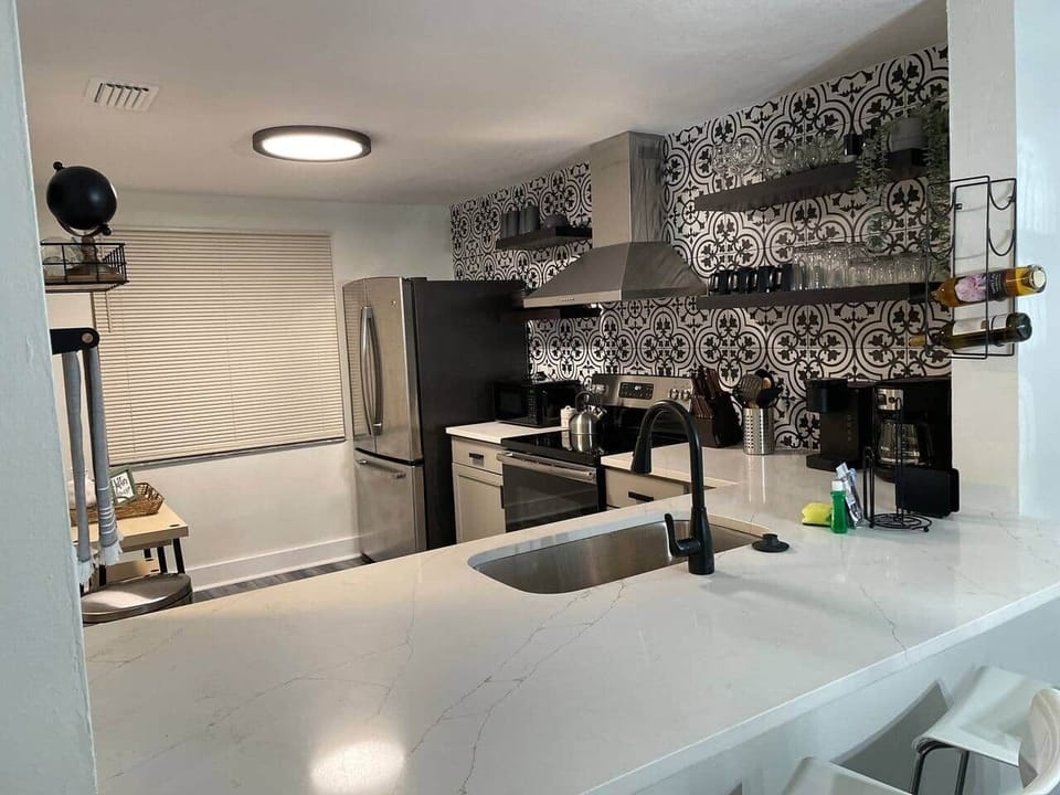 Cozy kitchen featuring a wine rack and coffee bar with wine and coffee included.