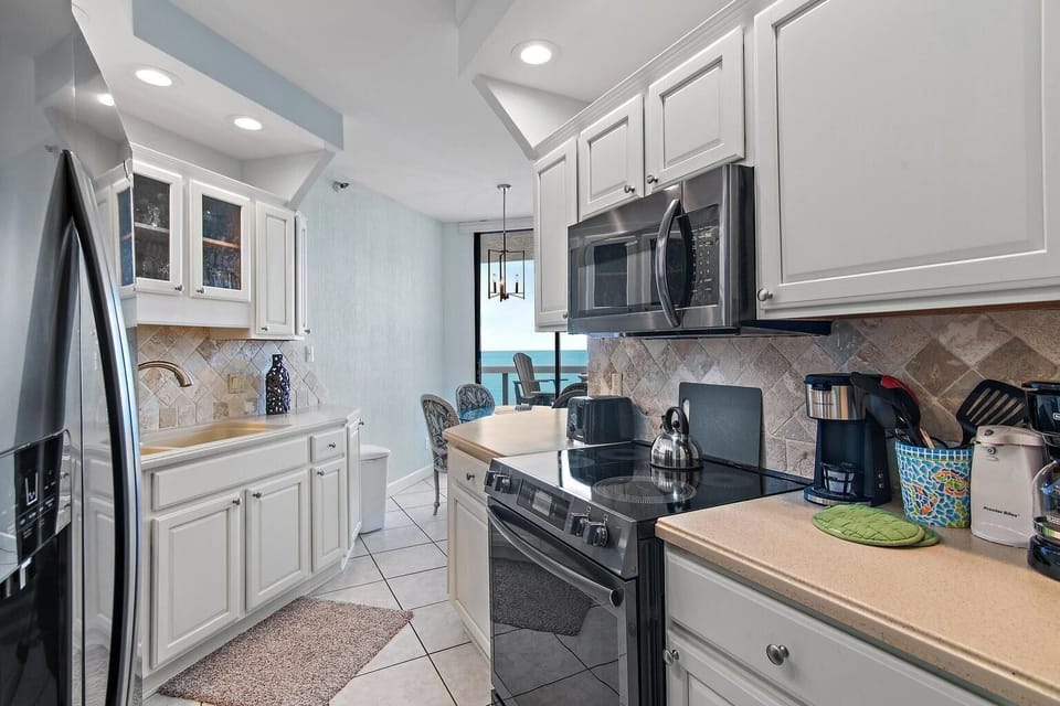 Bright, kitchen with cozy dining nook for gatherings