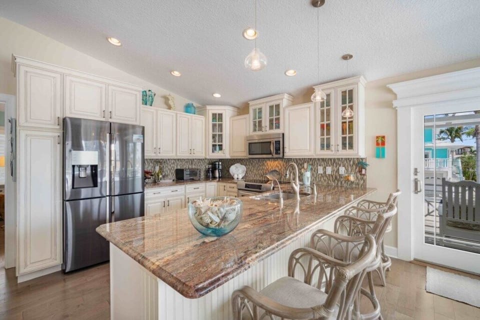 Full kitchen with large island and barstool seating