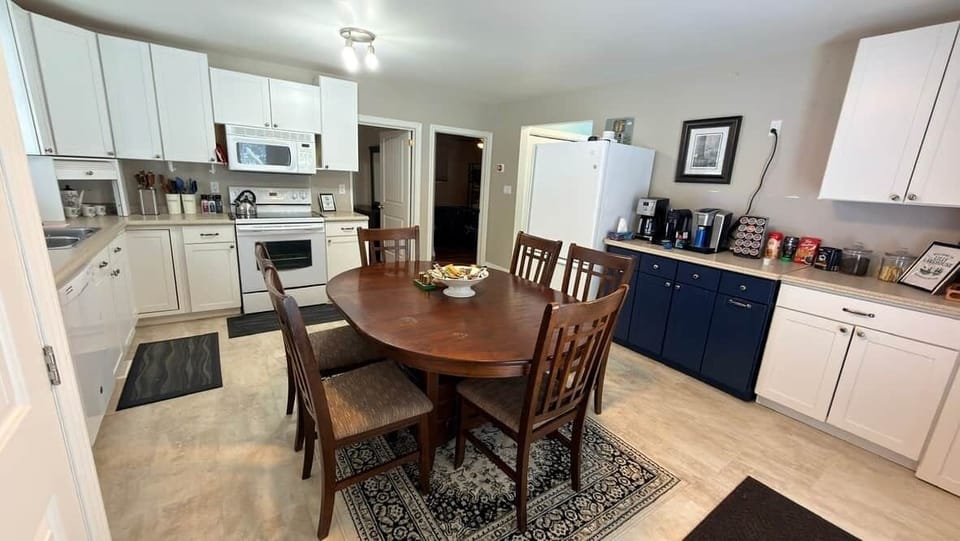 Open, family-friendly kitchen with full-size appliances, ample counter space, and a six-seat dining