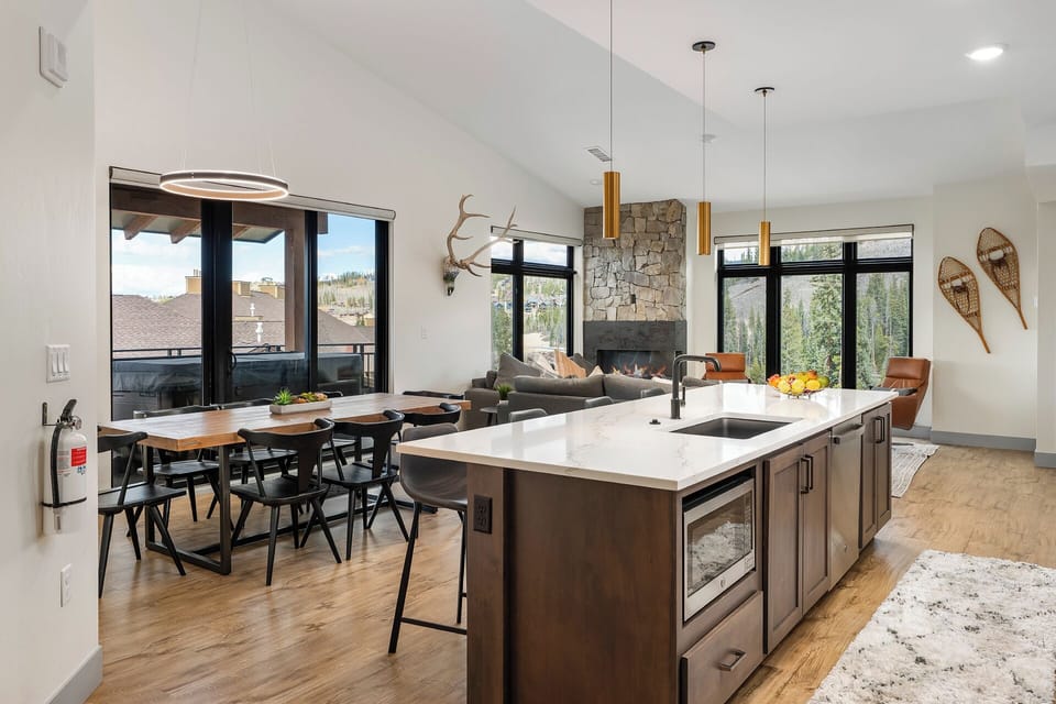 The open kitchen flows right into the dining area