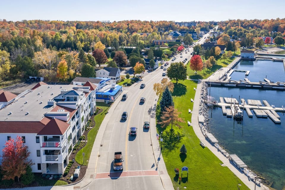 Aerial View: Vibrant fall colors surround this inviting retreat near Sister Bay`s waterfront!